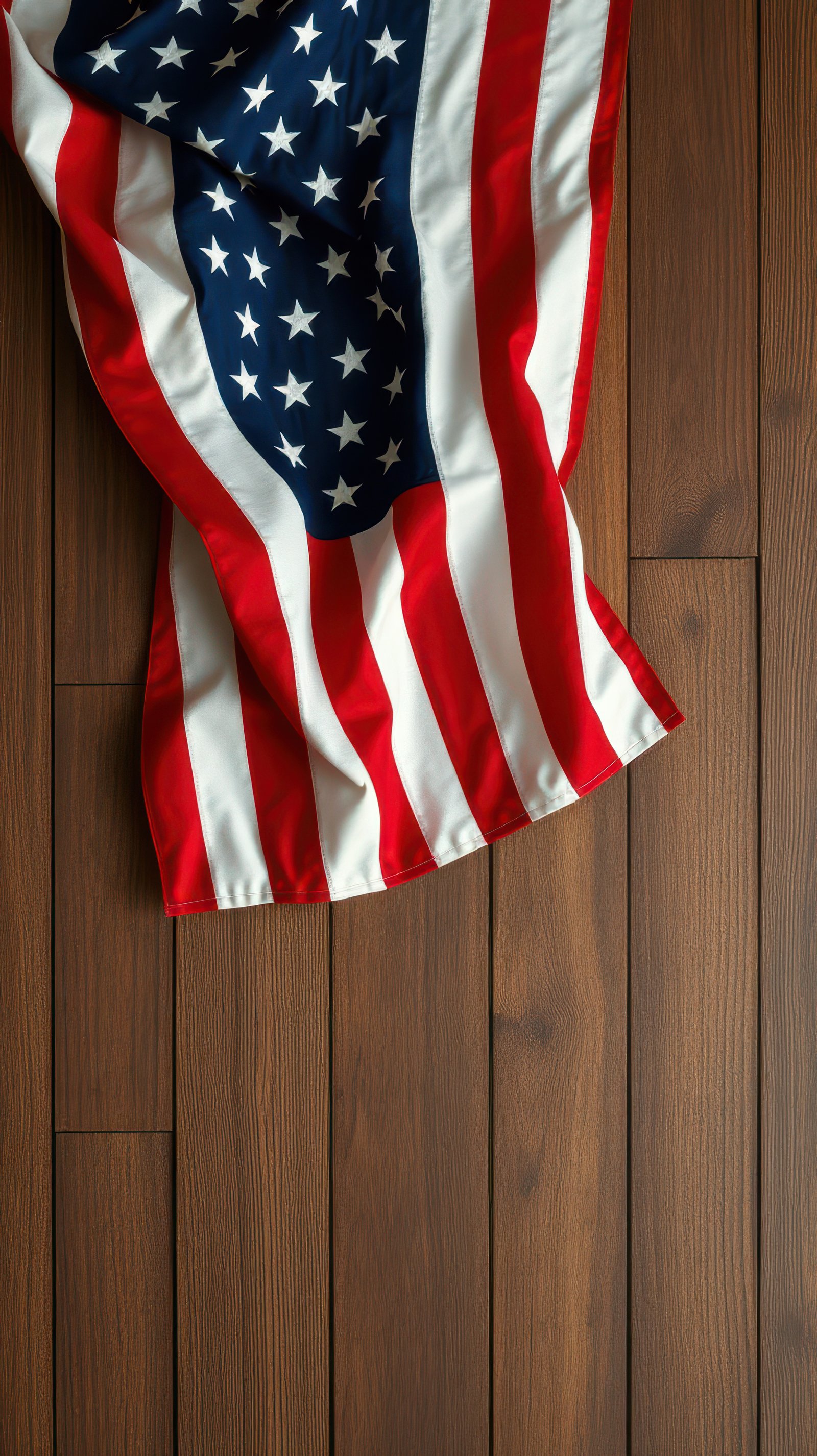 American flag draped over wooden floor exhibits patriotic colors and symbolism